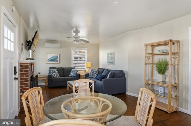 living room featuring ceiling fan, a wall mounted AC, dark hardwood / wood-style flooring, and a healthy amount of sunlight