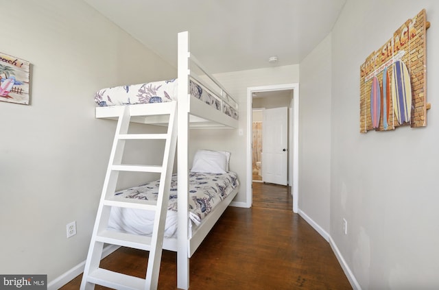 bedroom featuring dark hardwood / wood-style flooring