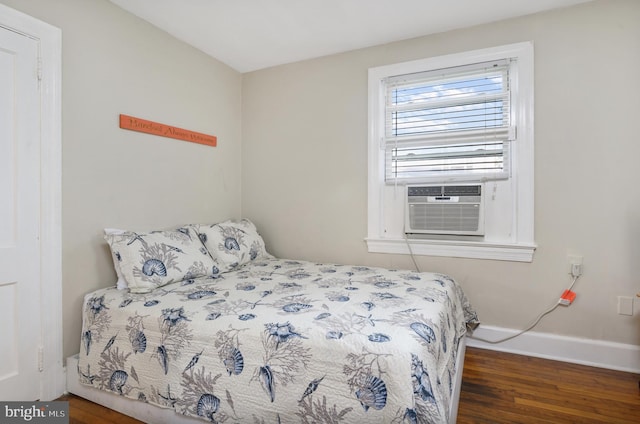 bedroom with dark wood-type flooring and cooling unit