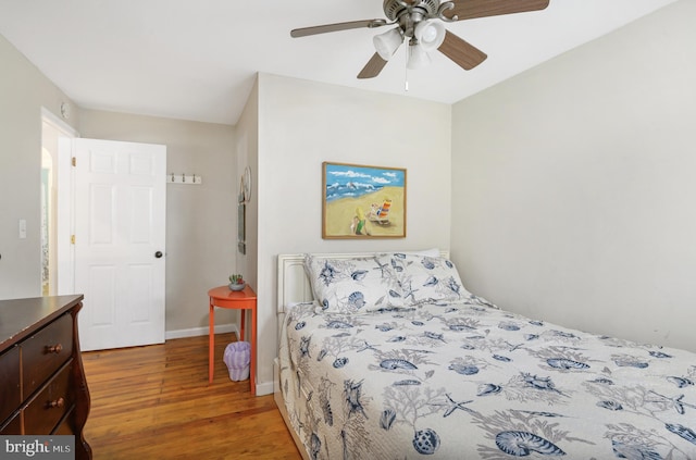 bedroom featuring ceiling fan and hardwood / wood-style floors