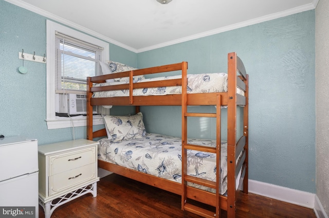 bedroom featuring cooling unit, crown molding, and dark wood-type flooring