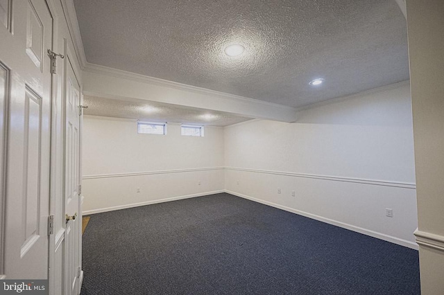 basement with crown molding, carpet floors, and a textured ceiling