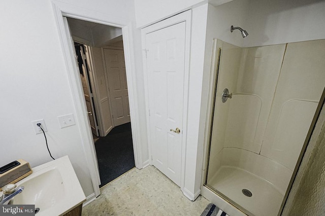 bathroom with vanity and an enclosed shower