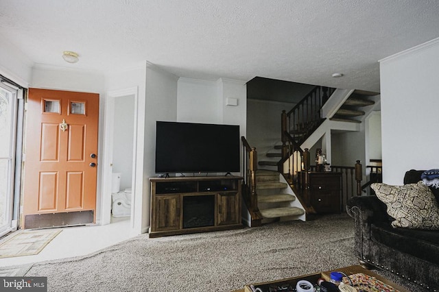 carpeted living room featuring a textured ceiling