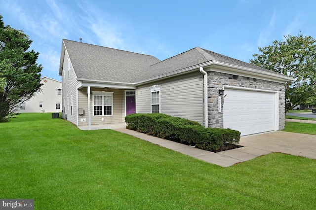 ranch-style house with a front yard and a garage