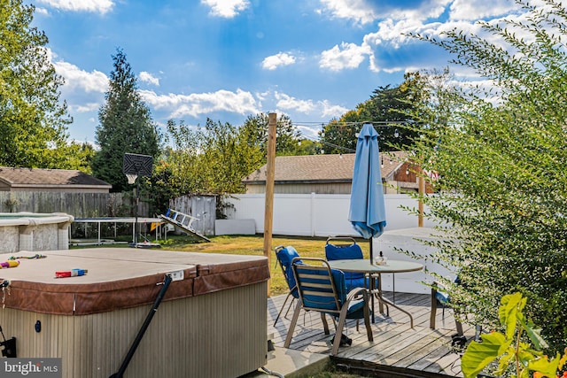 deck with a hot tub