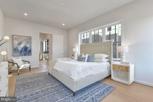 bedroom with hardwood / wood-style flooring