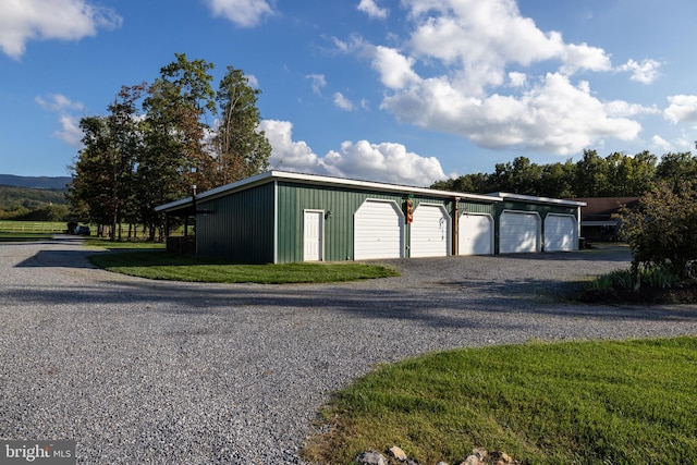 garage with a lawn