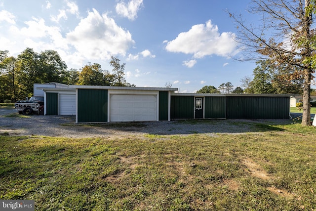 garage featuring a lawn