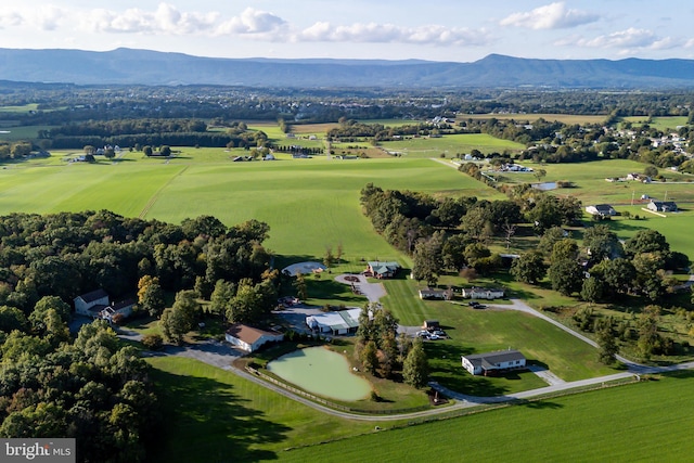 birds eye view of property with a mountain view