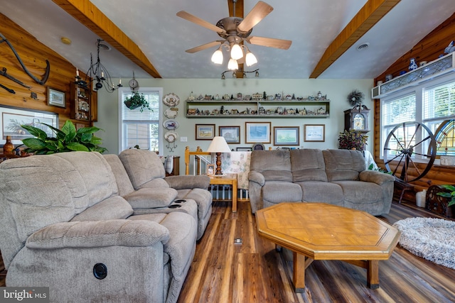 living room with vaulted ceiling with beams, hardwood / wood-style flooring, ceiling fan with notable chandelier, and plenty of natural light