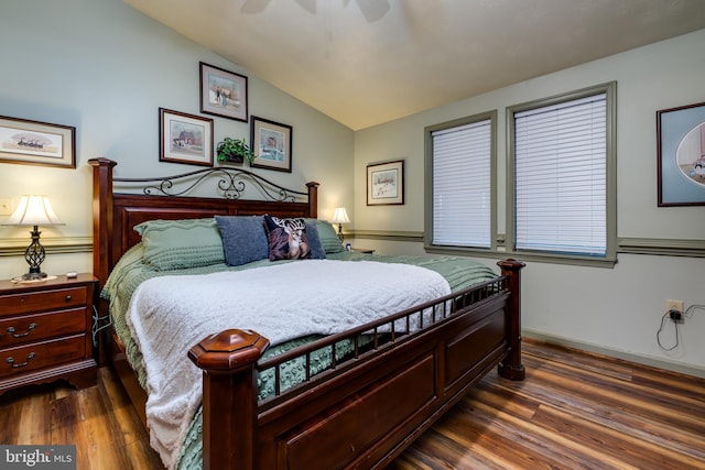 bedroom featuring lofted ceiling, ceiling fan, and dark hardwood / wood-style flooring