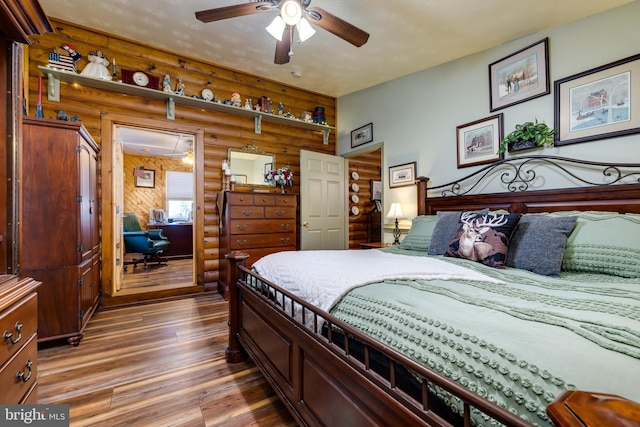 bedroom featuring hardwood / wood-style floors and ceiling fan