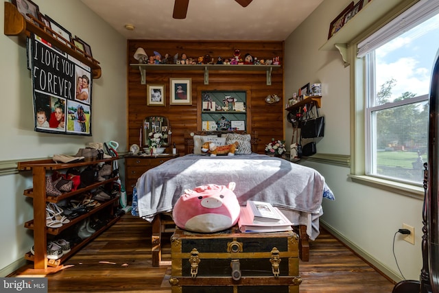 interior space featuring dark wood-type flooring and ceiling fan