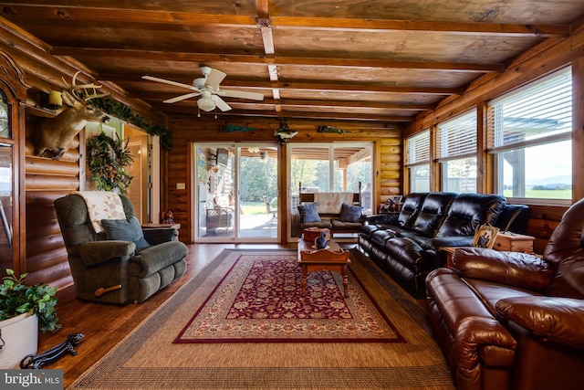 living room with vaulted ceiling with beams, dark wood-type flooring, wooden ceiling, log walls, and ceiling fan