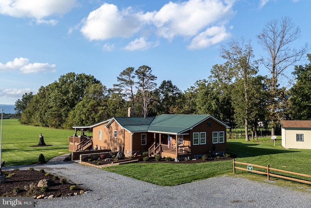 bungalow-style home with a front yard and covered porch