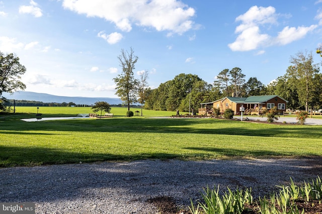 view of home's community featuring a yard and a mountain view