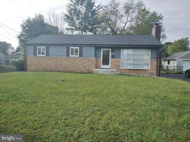 single story home featuring a front yard