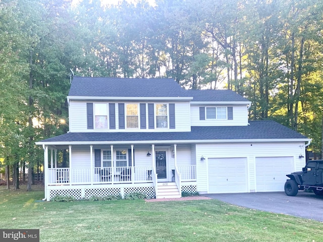 view of front facade with a front yard, a porch, and a garage