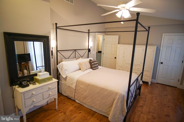 bedroom featuring dark wood-type flooring, ceiling fan, and vaulted ceiling