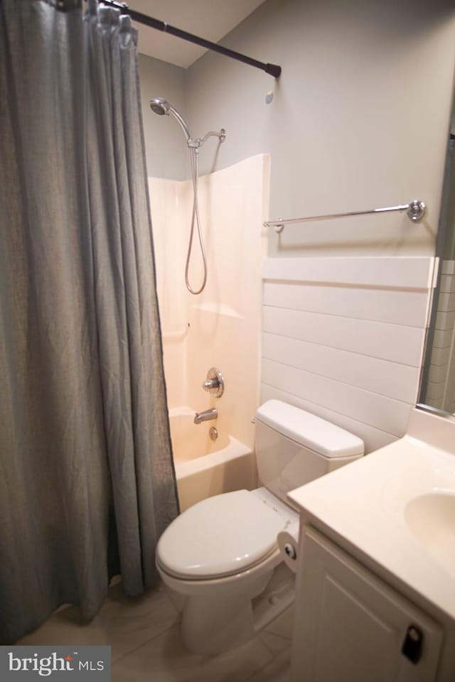 full bathroom featuring vanity, toilet, tile patterned floors, and shower / bath combination with curtain