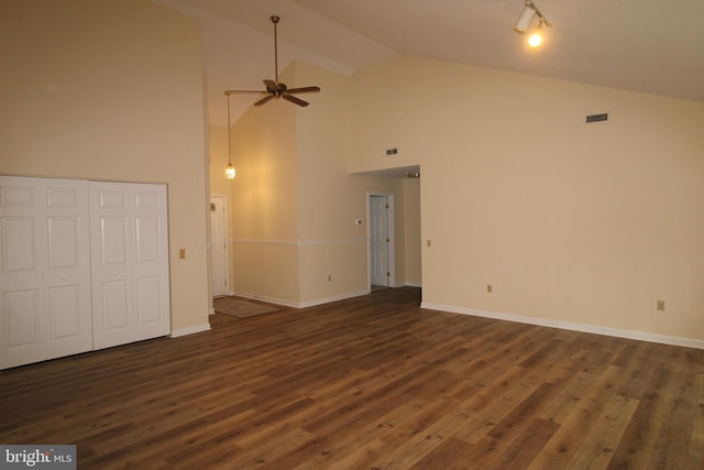 unfurnished living room featuring high vaulted ceiling, dark wood finished floors, a ceiling fan, visible vents, and baseboards