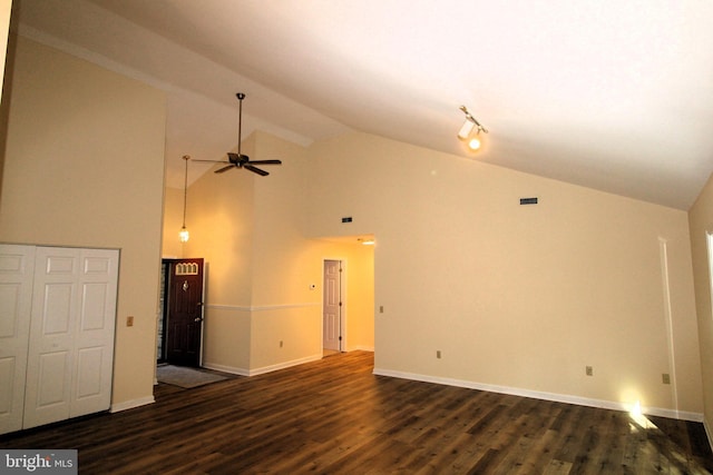 unfurnished living room with high vaulted ceiling, ceiling fan, baseboards, and dark wood finished floors