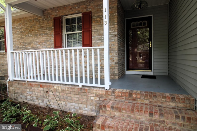 entrance to property with covered porch