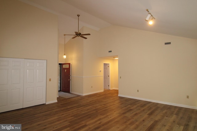 unfurnished living room featuring dark hardwood / wood-style flooring, high vaulted ceiling, and ceiling fan