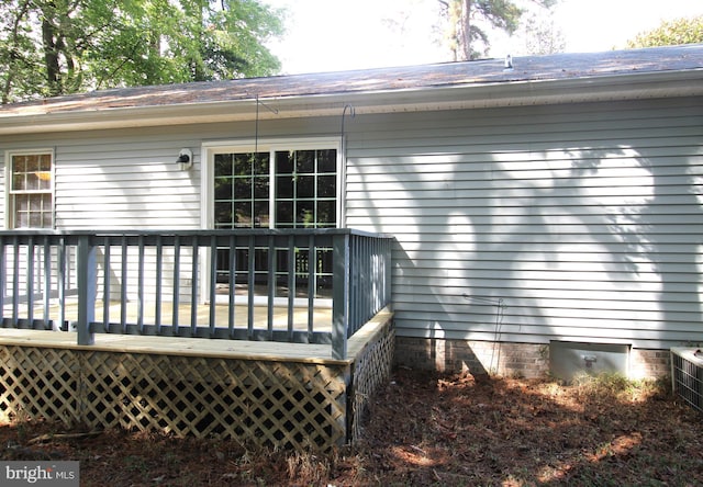 rear view of house with a wooden deck