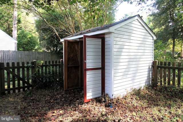 view of shed with a fenced backyard