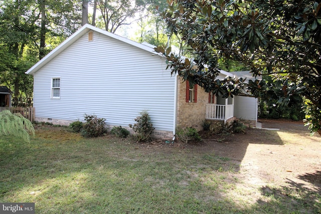view of home's exterior featuring a yard and crawl space