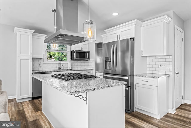 kitchen featuring island range hood, decorative light fixtures, white cabinetry, stainless steel appliances, and dark hardwood / wood-style flooring