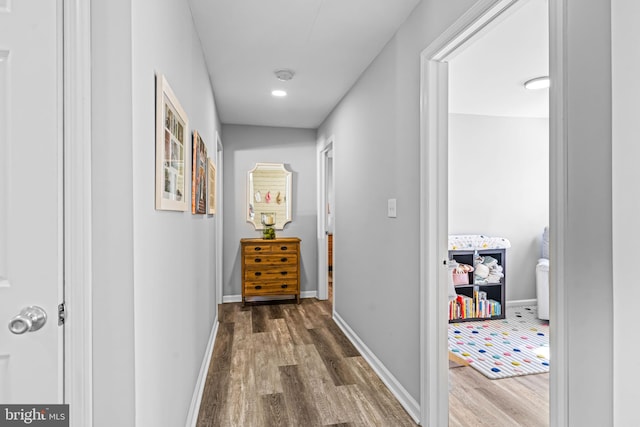 hall with hardwood / wood-style floors