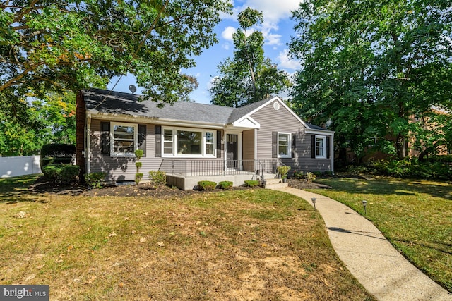 ranch-style house with a front lawn