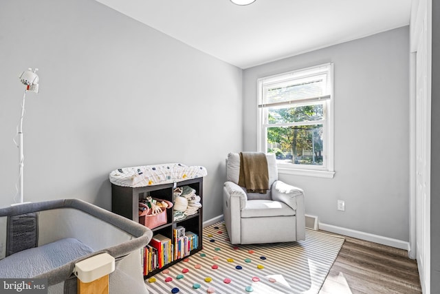 bedroom with hardwood / wood-style floors