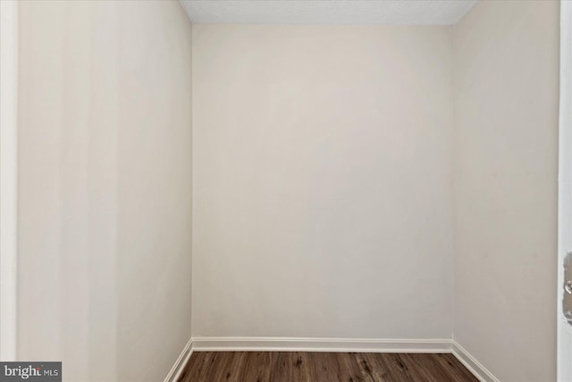 unfurnished room featuring dark hardwood / wood-style floors