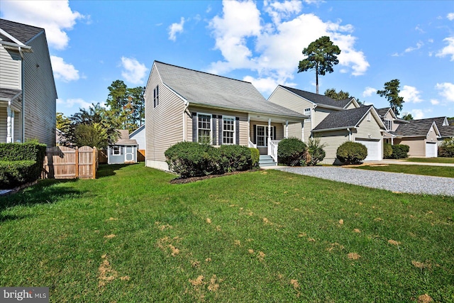 view of front of property with a porch and a front lawn