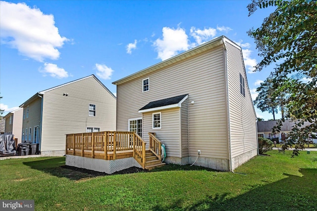 back of house with a deck and a yard