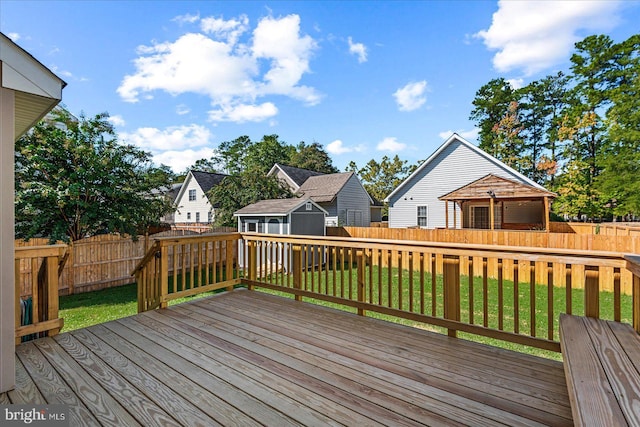 wooden terrace with a lawn