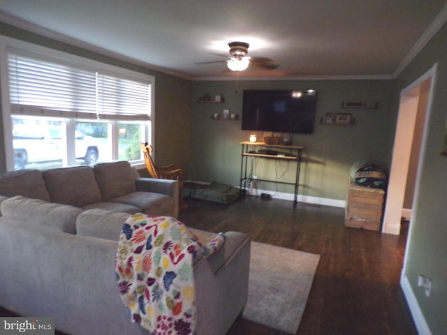 living room with crown molding, dark hardwood / wood-style floors, and ceiling fan