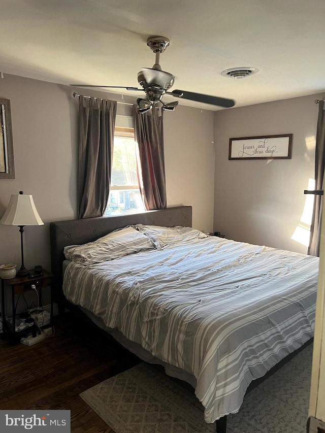 bedroom featuring dark wood-type flooring and ceiling fan