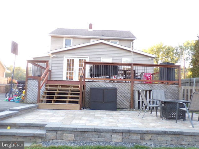 back of house with a patio and a wooden deck