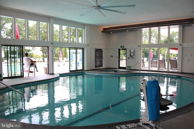 view of swimming pool featuring ceiling fan