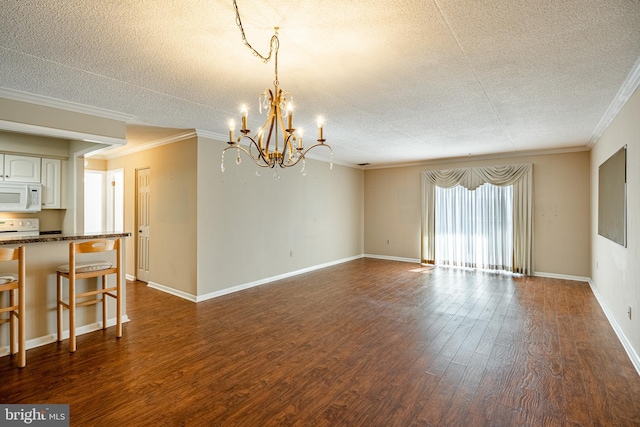 unfurnished living room with an inviting chandelier, crown molding, a textured ceiling, and dark wood-type flooring