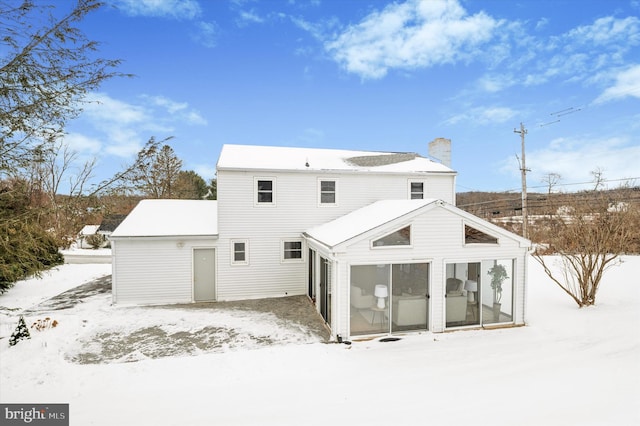 view of snow covered house