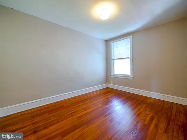 unfurnished room featuring hardwood / wood-style floors