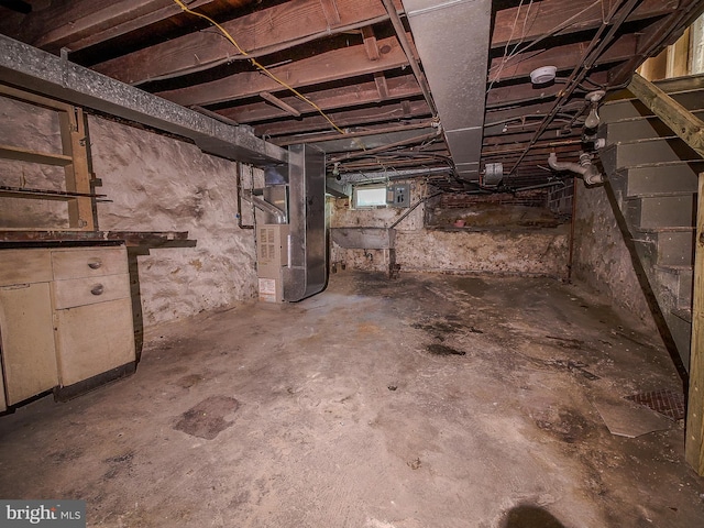 basement featuring heating unit