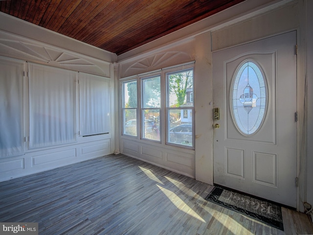 foyer entrance with wooden ceiling and hardwood / wood-style floors