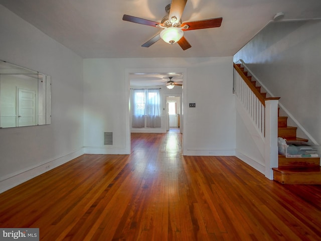 unfurnished living room with ceiling fan and hardwood / wood-style floors